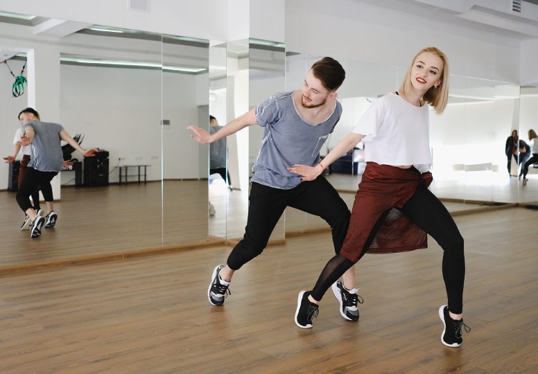 Young modern dancers dancing in the studio